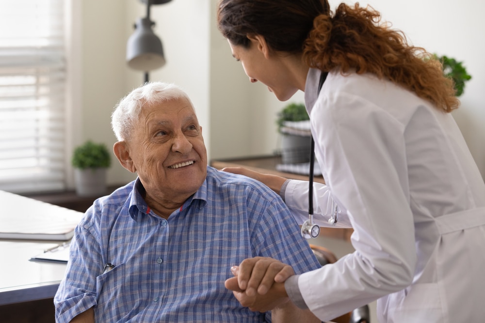 Patient speaking with a vein care provider during a consultation.